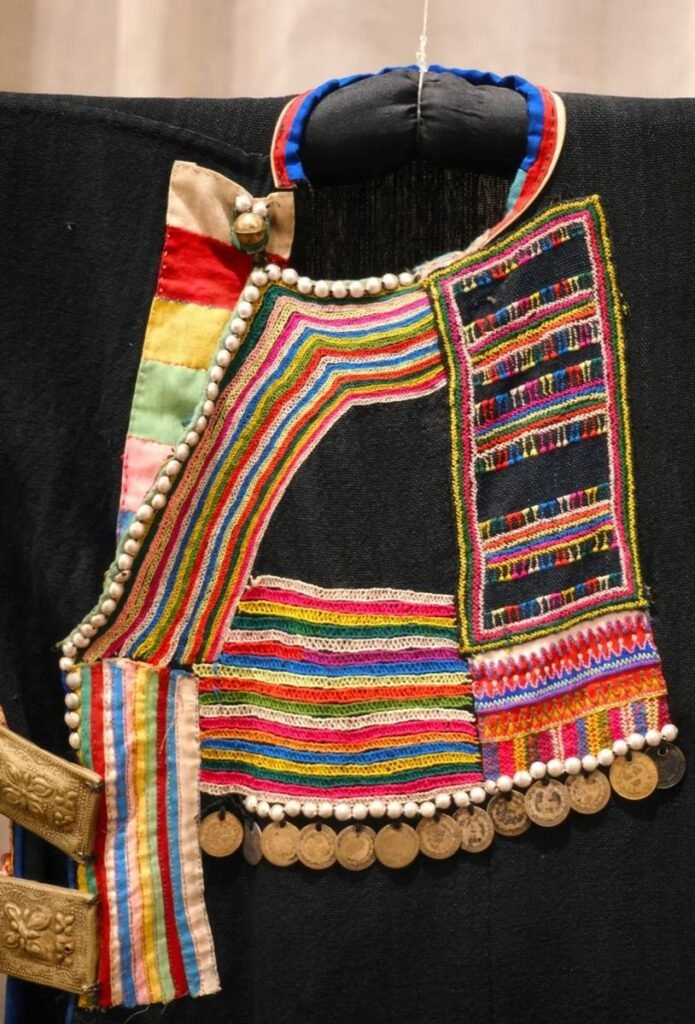 Embroidered ethnic costume with silver coins on display at TAEC