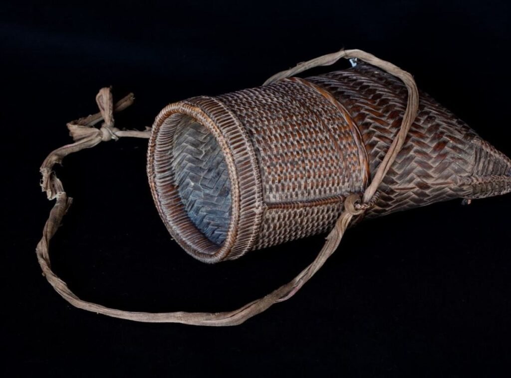 Woven rattan carrying basket from the TAEC collection