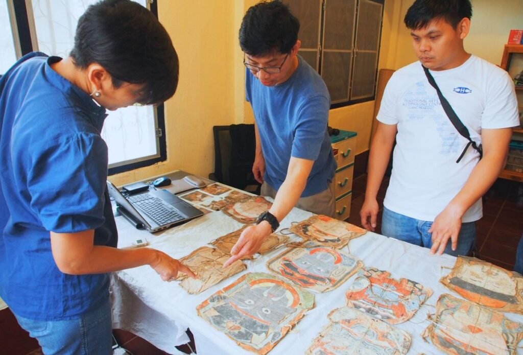 TAEC team documenting historic artefacts