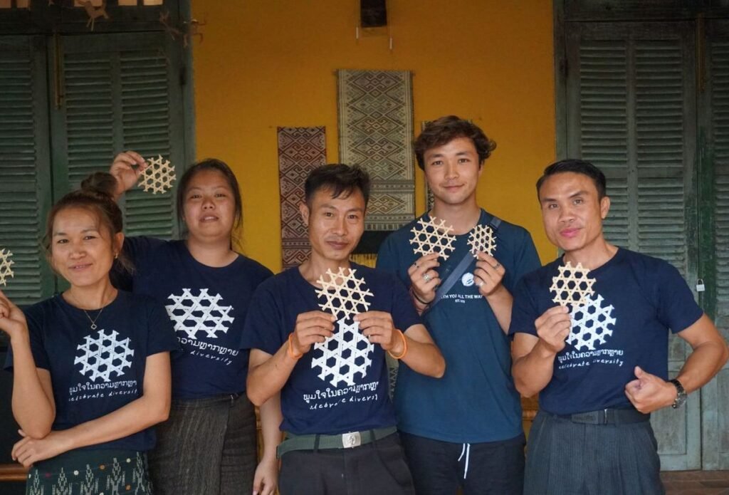 Visitors holding bamboo weaving made at the TAEC workshop